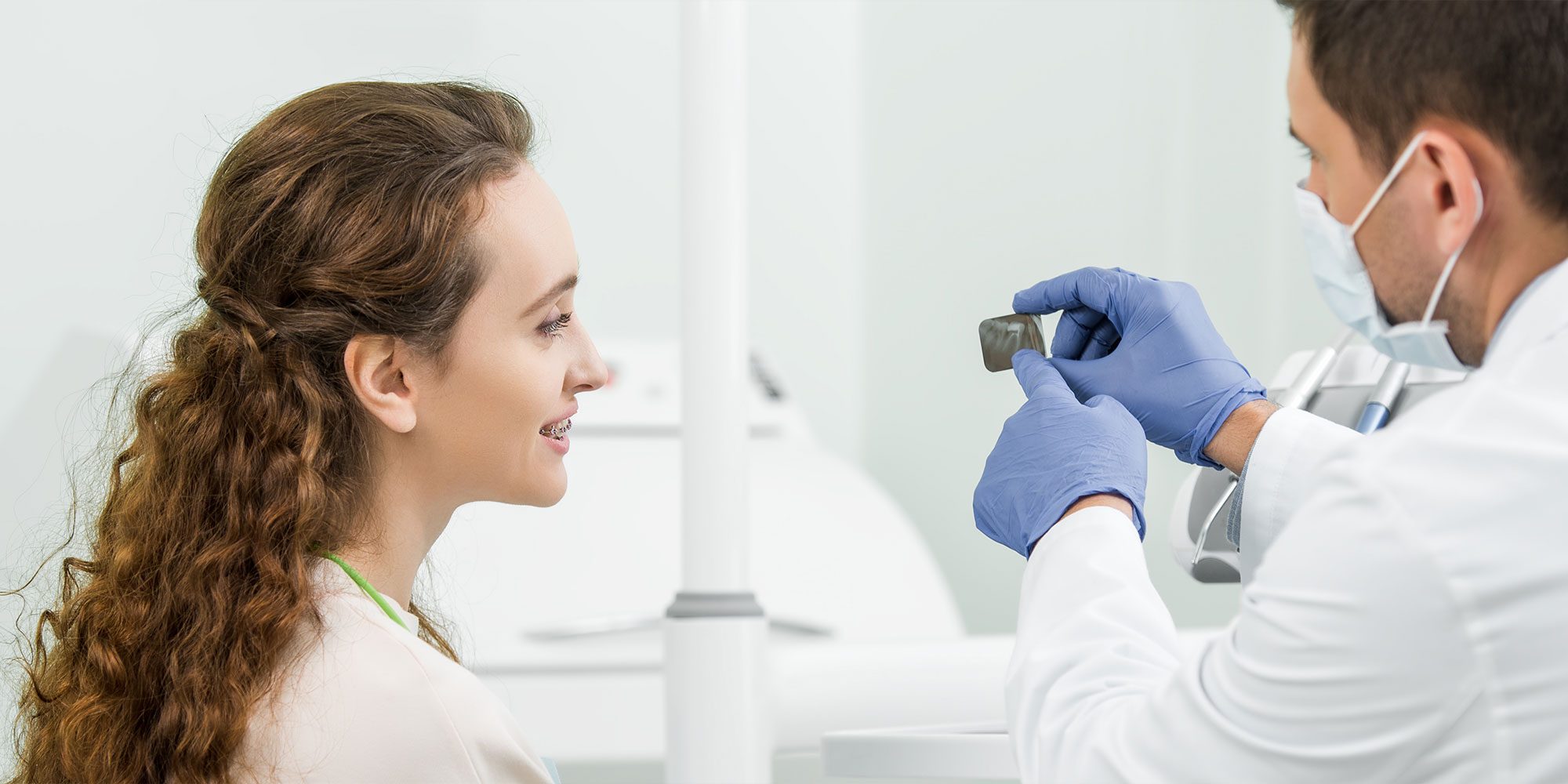doctor and patient going over dental technology for patient's procedure