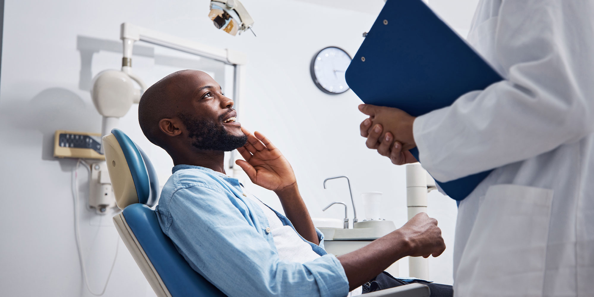 patient goin over dental procedure information with doctor