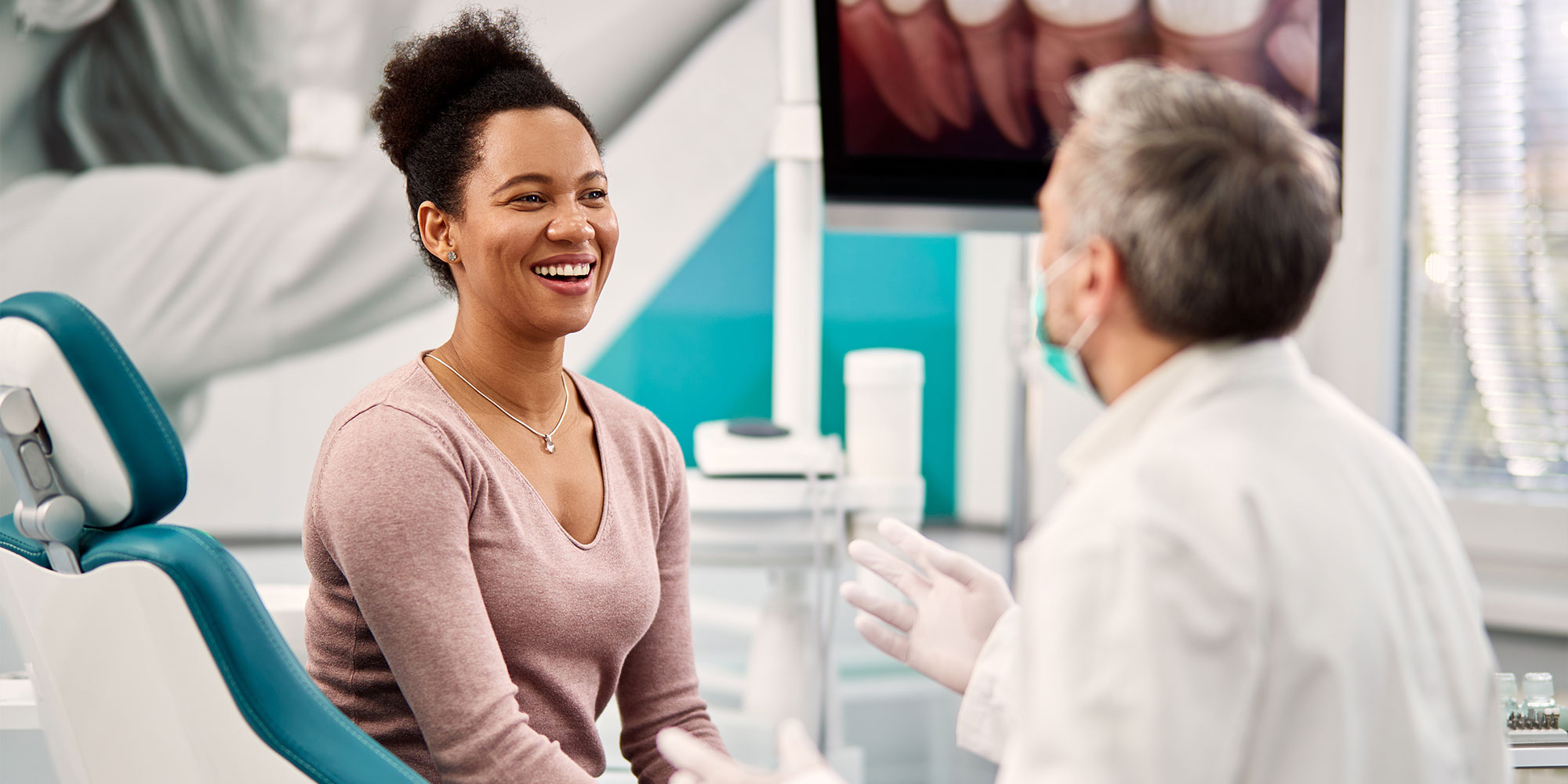 patient and doctor going over dental procedure information within dental office