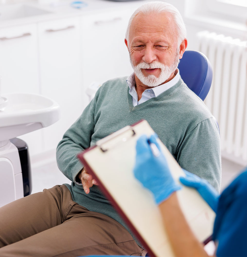 patient going over dental consultation for dental implant procedure